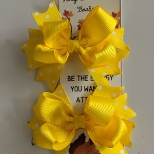 Yellow pigtail bows